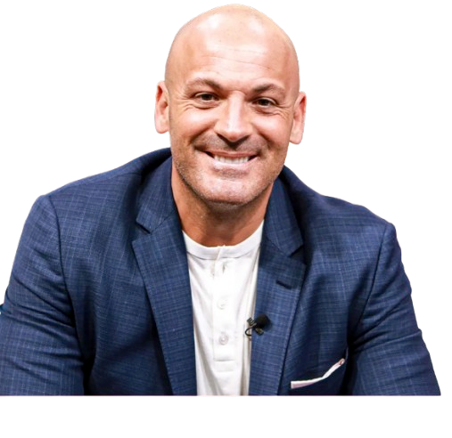 Smiling bald man in a blue blazer and white shirt.