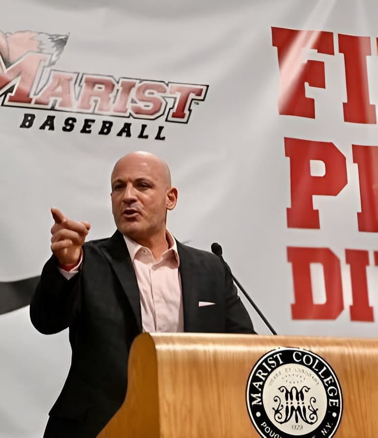 Man speaking at Marist College baseball event.